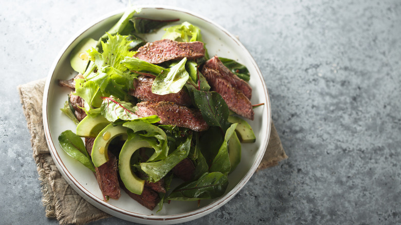Beef salad with avocado and lettuce