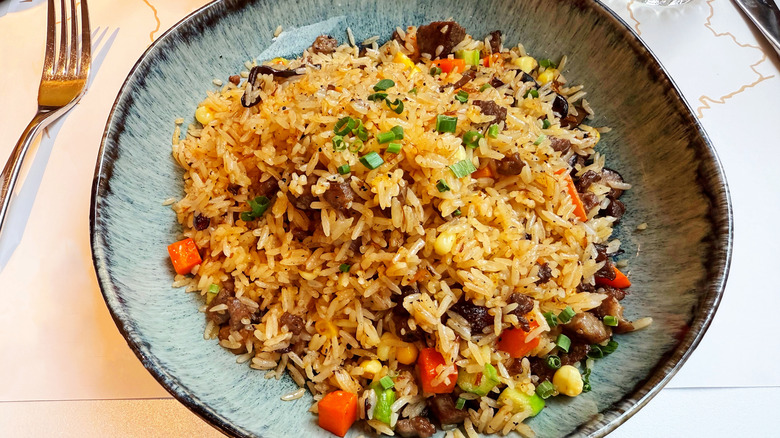 Fried rice on a plate with veggies