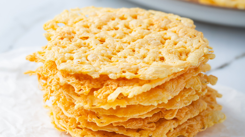 Parmesan chips on white background
