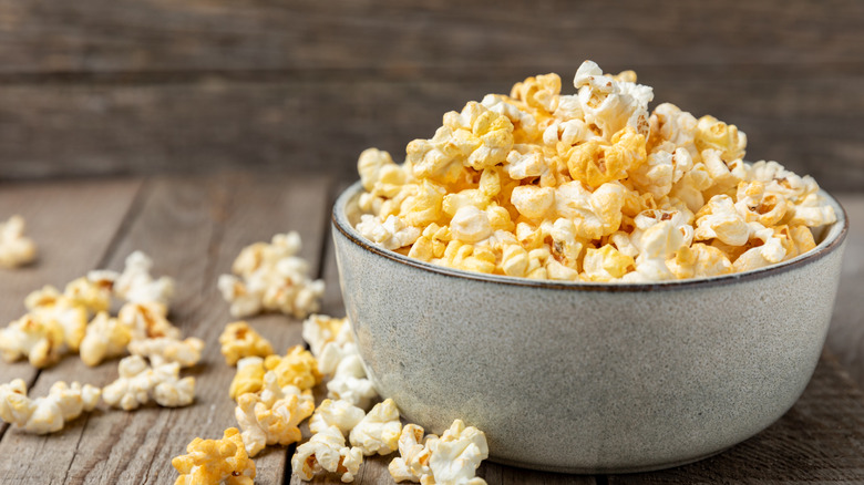 Bowl of popcorn on a wooden table