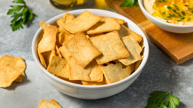 Pita chips in a bowl on a table