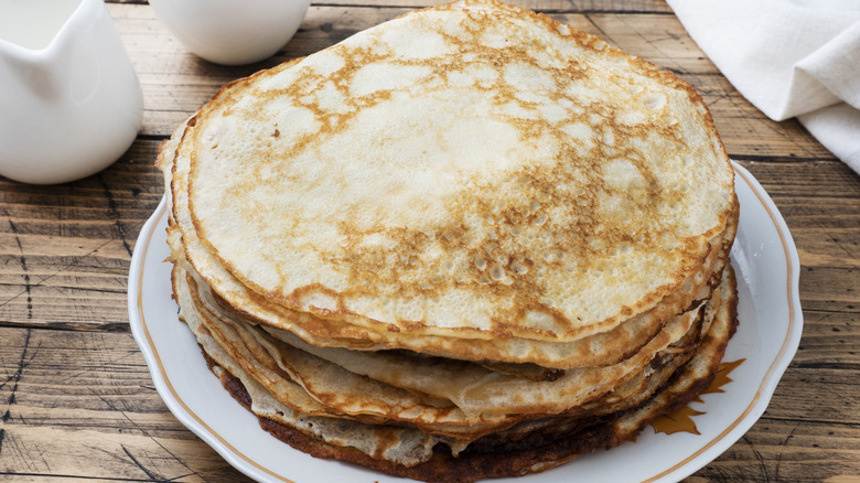 oversized pancakes stacked on a plate