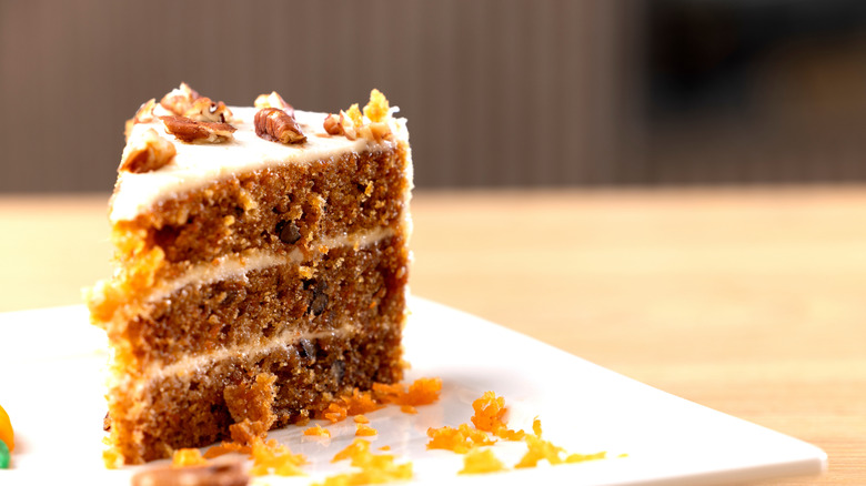 Carrot cake on a plate with frosting