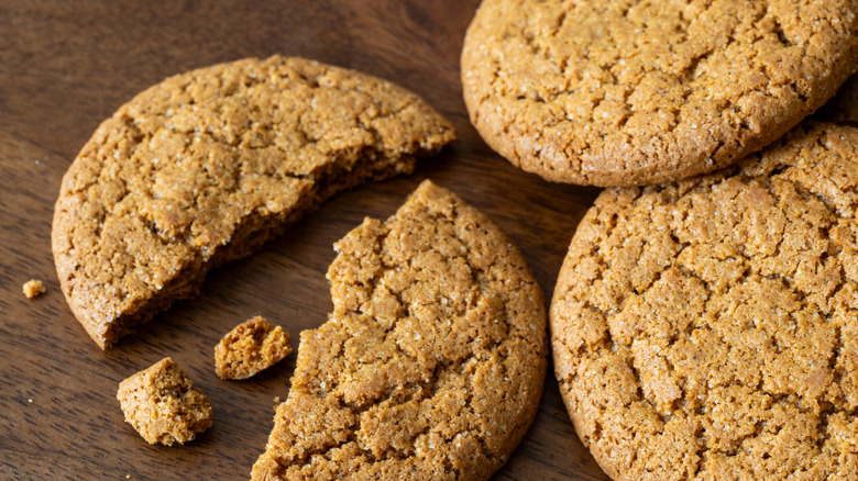 Gingersnap cookies on a brown surface