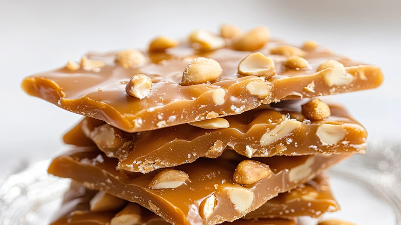 Peanut brittle on white plate