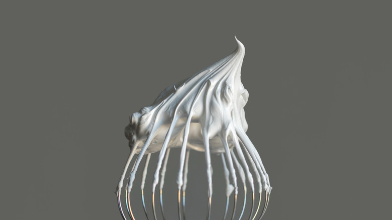 whipped egg whites on whisk