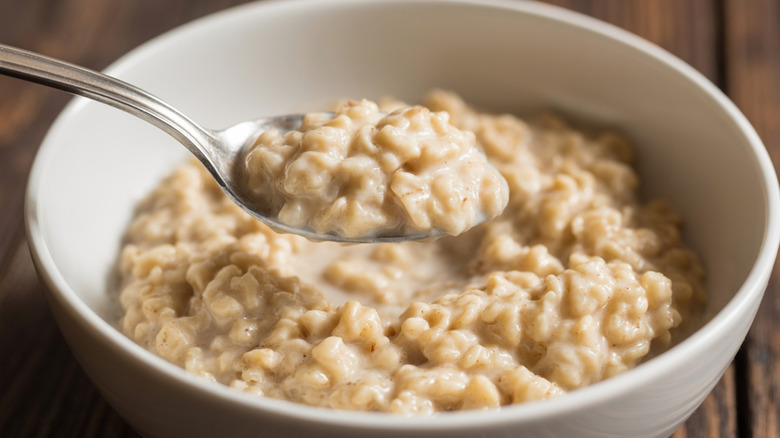 Oatmeal in a dish with a spoon