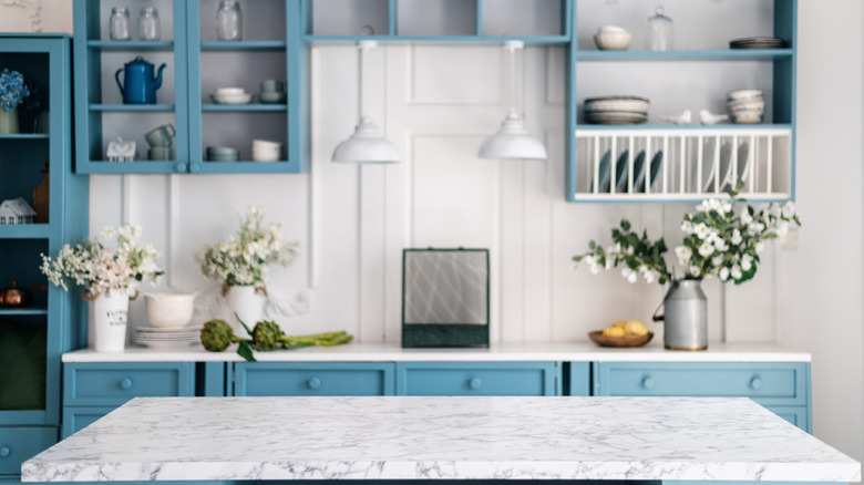 Marble kitchen island with blue countertops