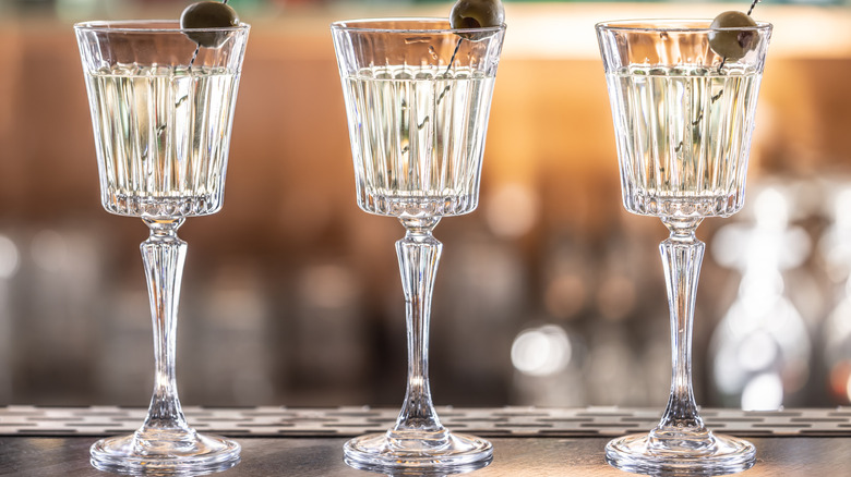 three martinis with olives