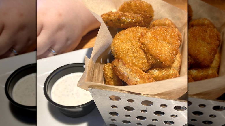 Deep-fried breaded pickles with ranch dip