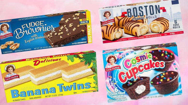 Composite image of boxes of Little Debbie fudge brownies, Boston creme rolls, banana twins, and cosmic cupcakes on a pink background