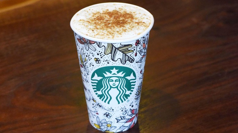 A fall Starbucks takeout cup on a table filled with toasted Graham latte