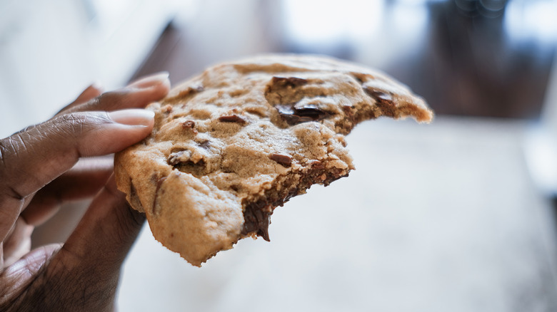 Chocolate chip cookie in hand