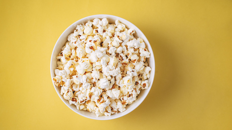 Bowl of popcorn on a yellow background