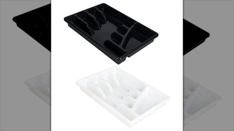 Two pre-proportioned cutlery trays one is black, and the other white