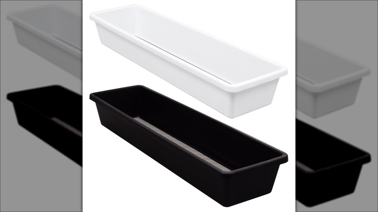 Two drawer organizers one white, one black