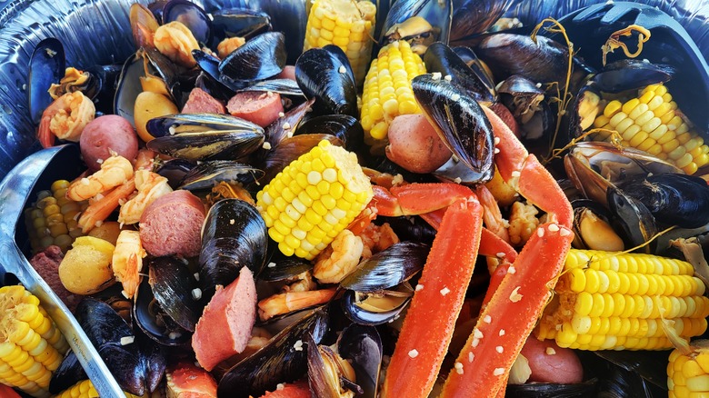 Seafood boil with sausage, mussels, and corn