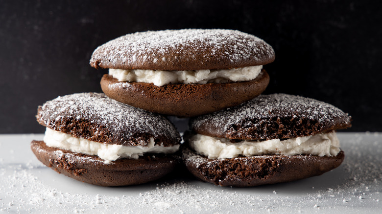 Whoopie pie on a table with powdered sugar