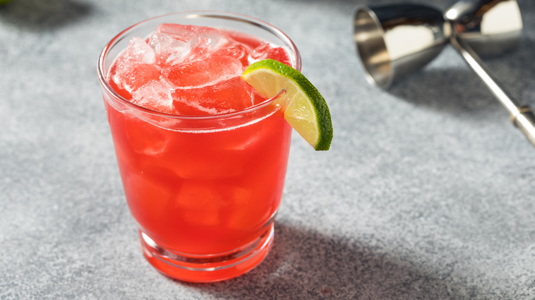 A Mexican firing squad cocktail garnished with a lime