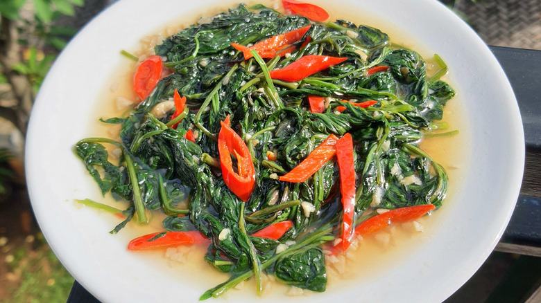 Plate of sautéed kale with chiles
