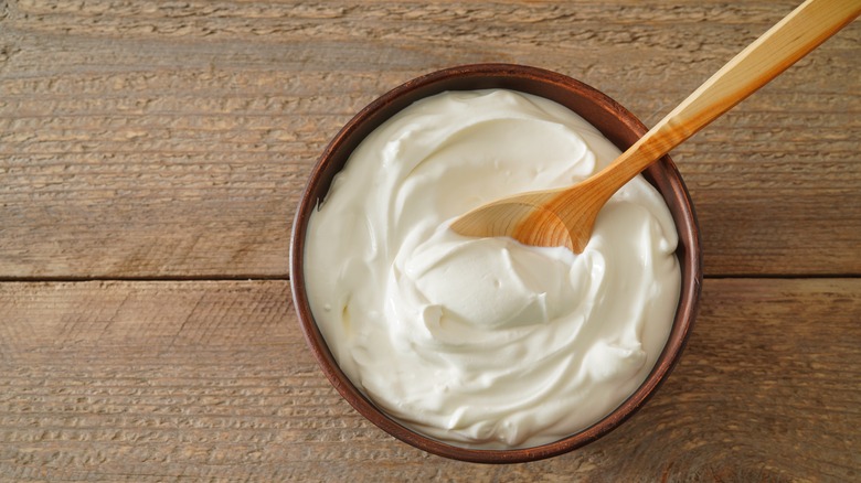 Sour cream in a bowl with a spoon