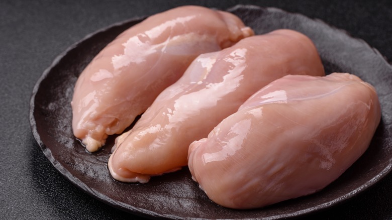Skinless chicken breasts on a plate