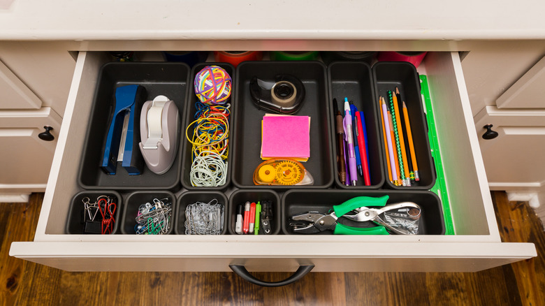Junk drawer with many different supplies