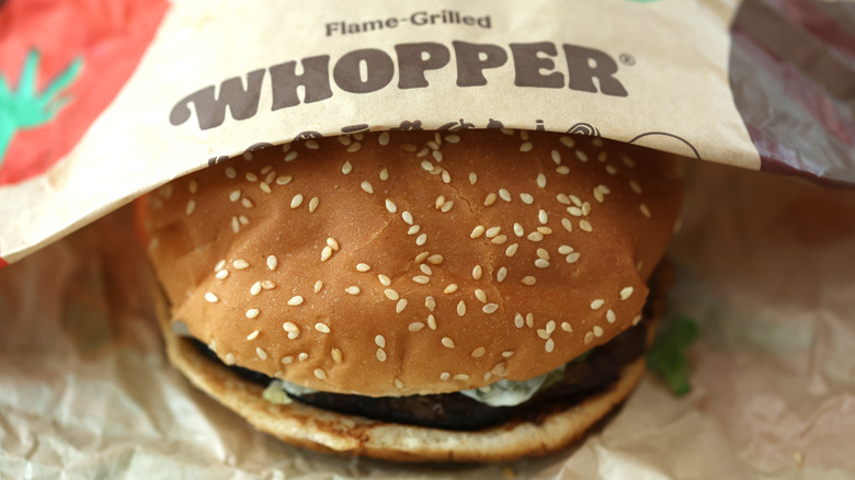 up-close of Whopper peaking out of package