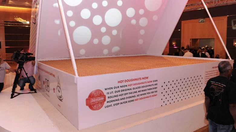 A giant Krispy Kreme box holds thousands of donuts.