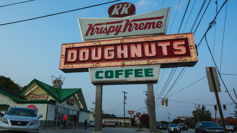 A historical photo shows customers lining up for donuts at Krispy Kreme.