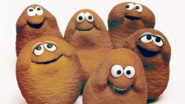 Six McNugget Buddies smile as a group.