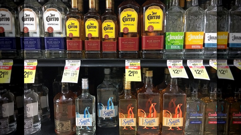Bottles of tequila on a shelf at a liquor store