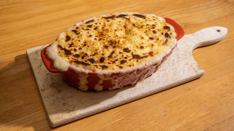 Mac and cheese in baking dish, with caramelized topping