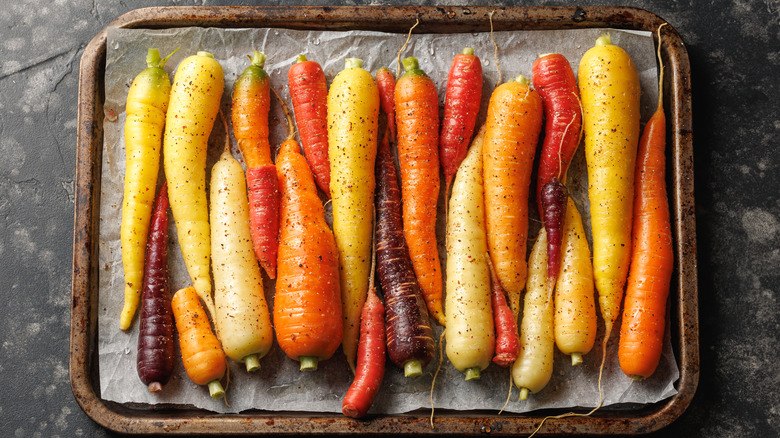 a tray of multi-color carrots