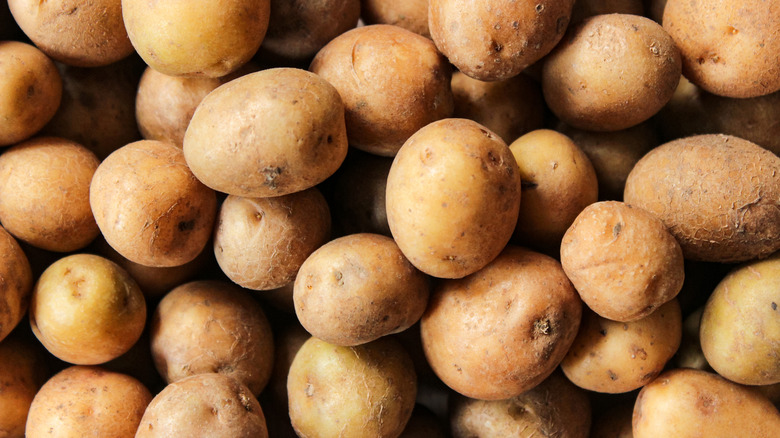 Whole potatoes as background