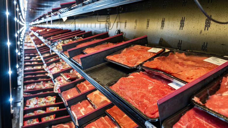 Steaks in a refrigerator case in a grocery store
