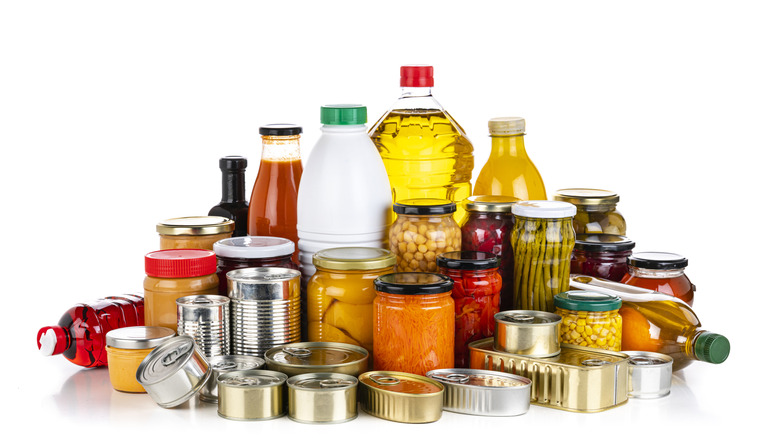 A variety of jars, cans, and bottles without labels