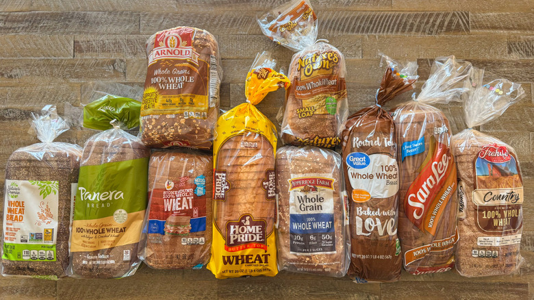 Ten packages of wheat breads on wooden background