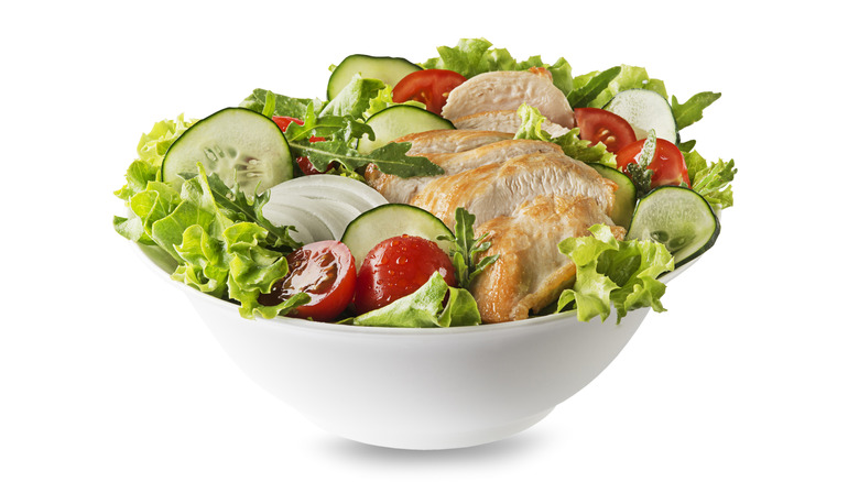 A salad with grilled chicken