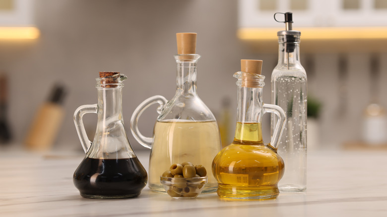 Bottles of olive oil and vinegar on a counter