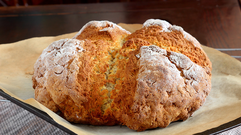 A loaf of soda bread on a pan
