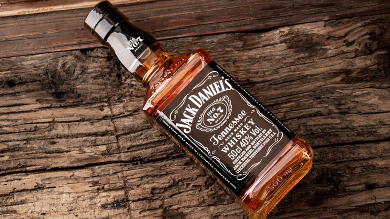 A bottle of Jack Daniels on a wooden table