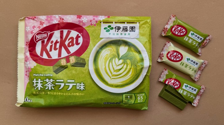 Opened bag of Matcha Latte Kit Kats surrounded by individually wrapped pieces