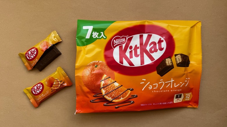 Opened bag of Chocolate Orange Kit Kats surrounded by individually wrapped pieces