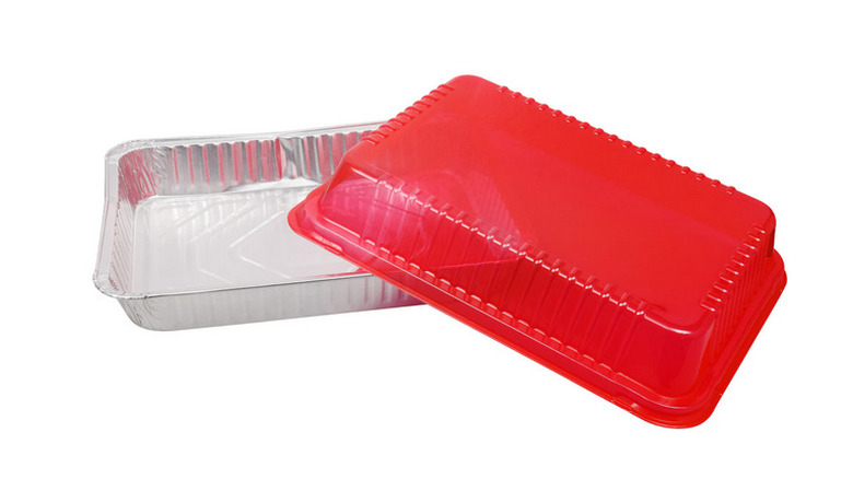 Aluminum pan with a red lid