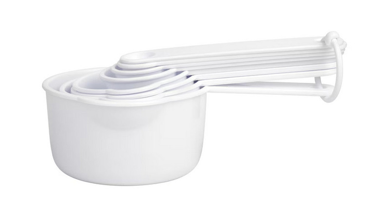 White measuring cups against a white background