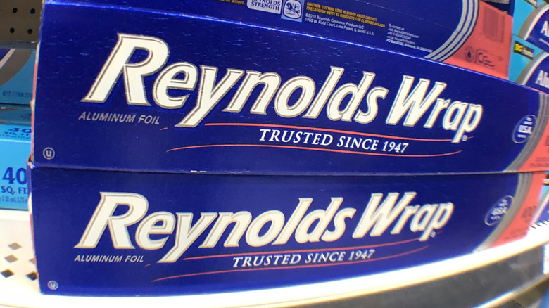 A stack of Reynolds Wrap aluminum foil on a store shelf