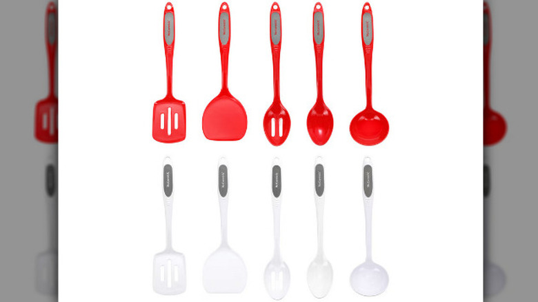 Red and white cooking utensils on a white background