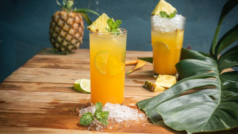 Two pineapple cocktails on a table