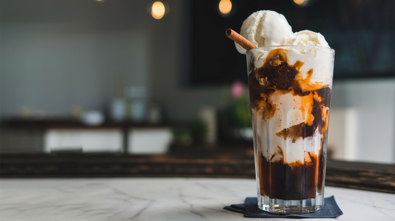 Root beer float in a glass on a table